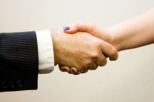 Photo of People Shaking Hands